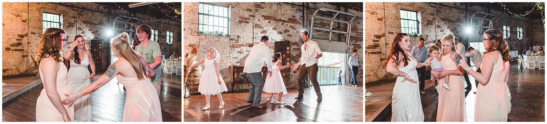 Guests, bride and groom enjoy reception together while dancing to great music